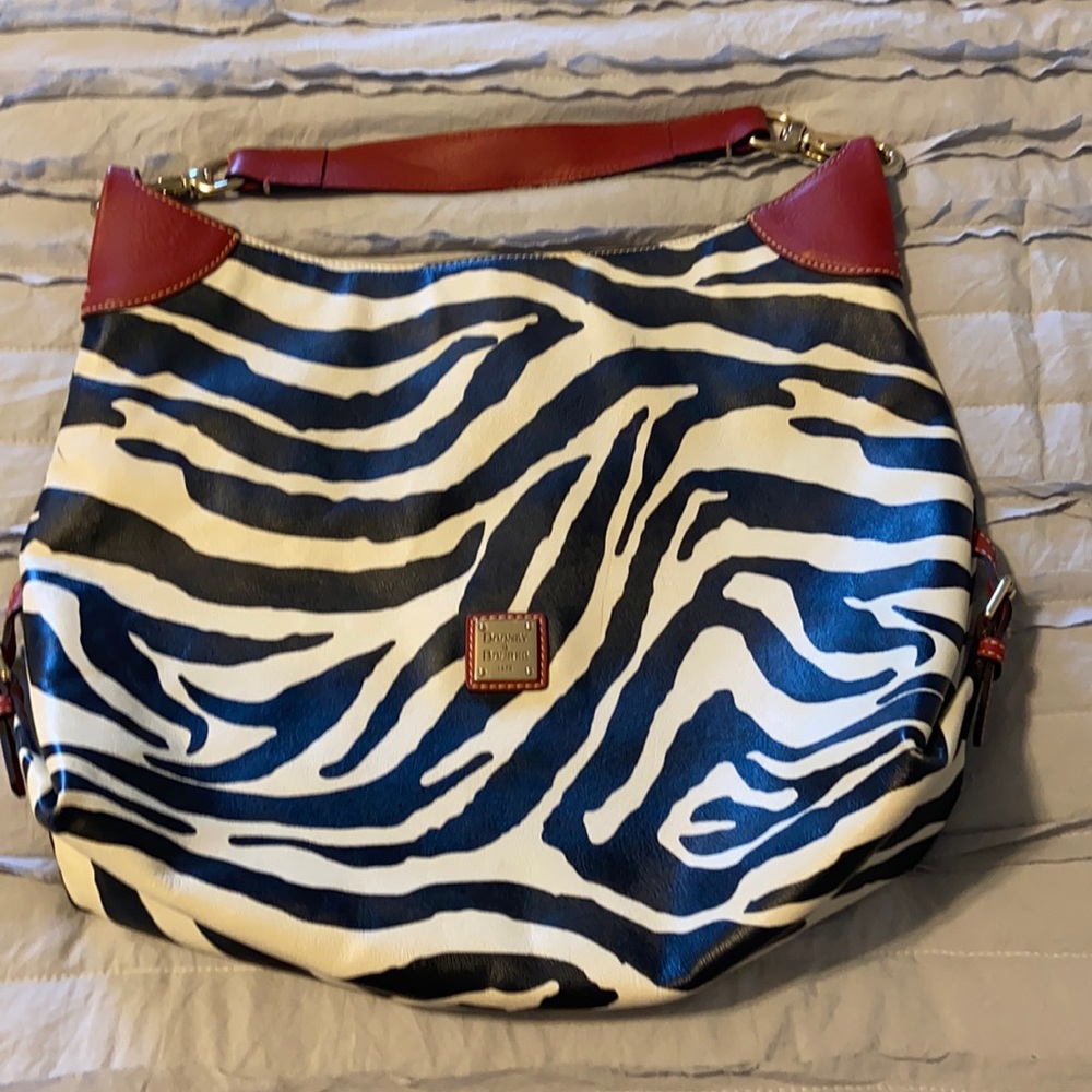 Zebra print Dooney & Bourke over the shoulder bag.